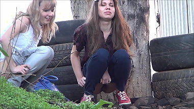 Two cute teen piss outdoors.