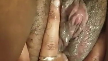 Fingering her creamy pussy