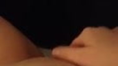 Woman fingering her wet pussy.