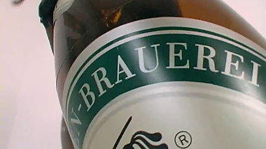 latex girl and big beer bottle