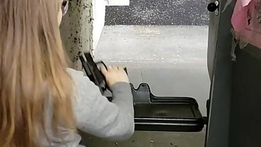 Chick with nice dumper shooting gun