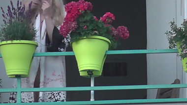 My sexy neighbor flashing her bald pussy on balcony