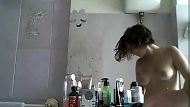 My wife in toilet getting ready for the day