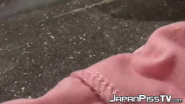 Debaucherous Asian schoolgirl peeing hard in public