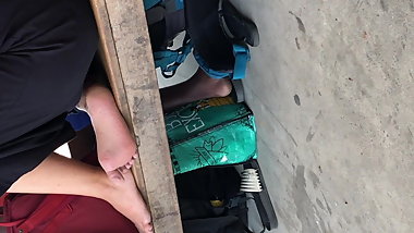 Candid soles by teen girl at the bus station