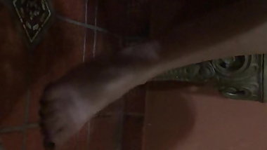 Candid teen girl dangling in barefeet