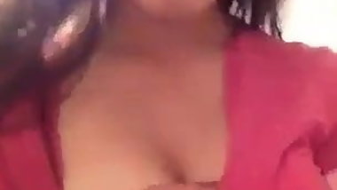 Teen showing her boobs off.