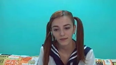 Schoolgirl model strips naked and fingers ass and pussy