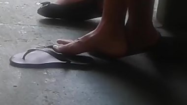 Latino guy showing his feet at school